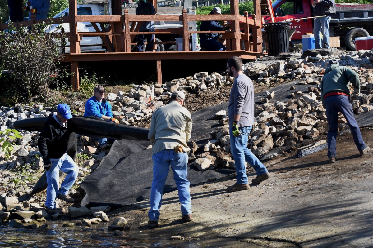 Volunteers work on Star City Riverfront